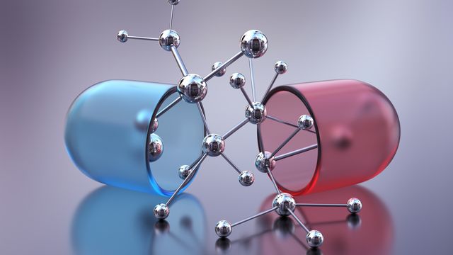 Molecular structure emerging between blue and red capsules, symbolizing modern drug discovery. 