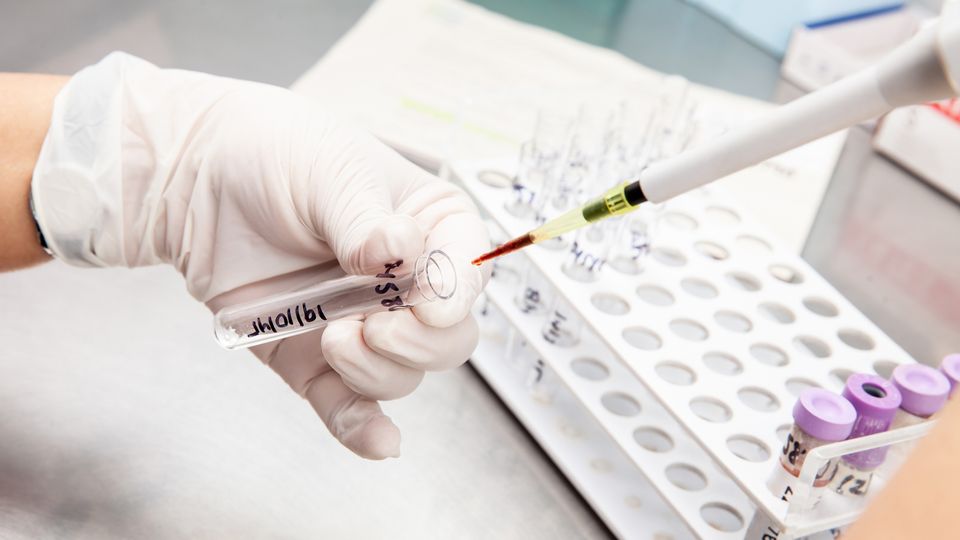 Scientist preparing samples for flow cytometric analysis in the laboratory