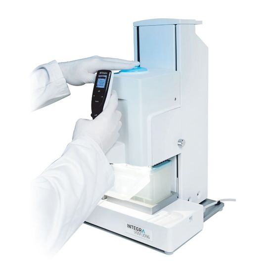 The Viaflo 96 on a white background with a Scientist using the machine 