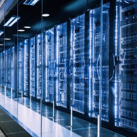 Modern data center with illuminated server racks, representing digital science infrastructure. 